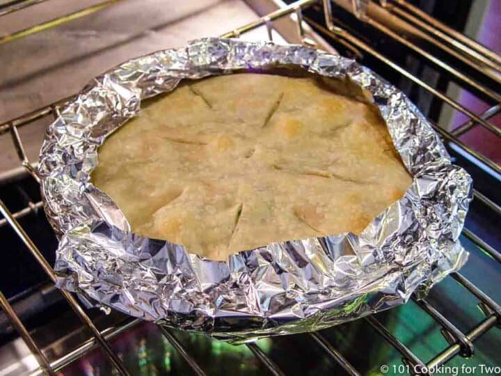 protecting the edge of a chicken pot pie with foil