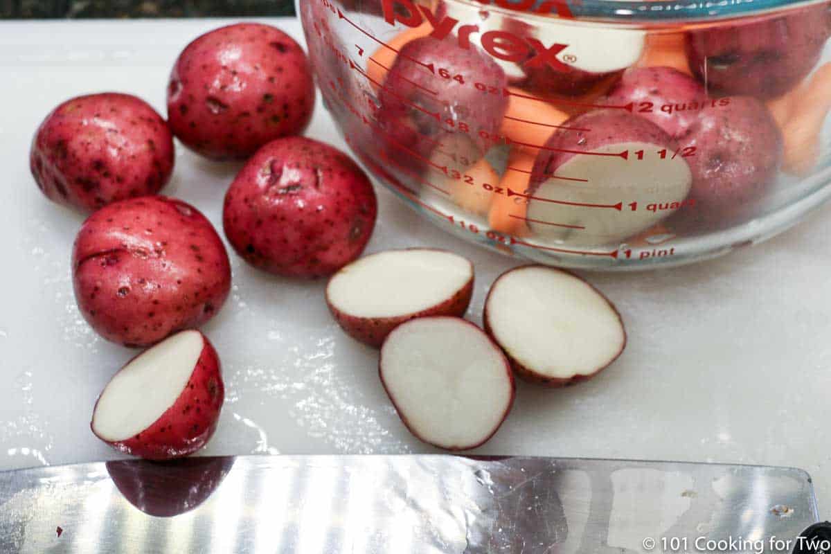 trimmed red potatoes on a white board