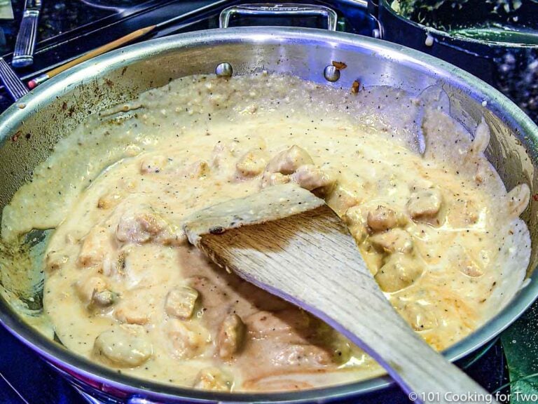 chicken alfredo sauce in a sauce pan