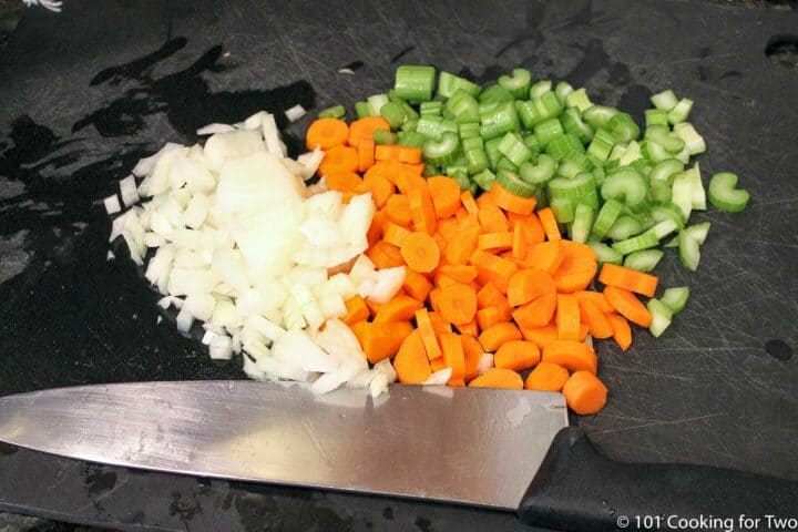 chopped vegetables on a black board