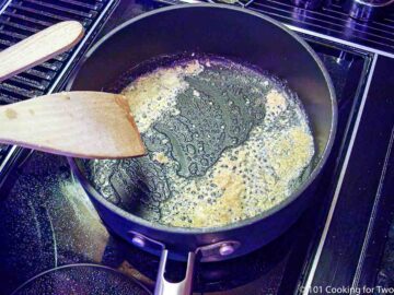 cooking garlic in butter in a sauce pan