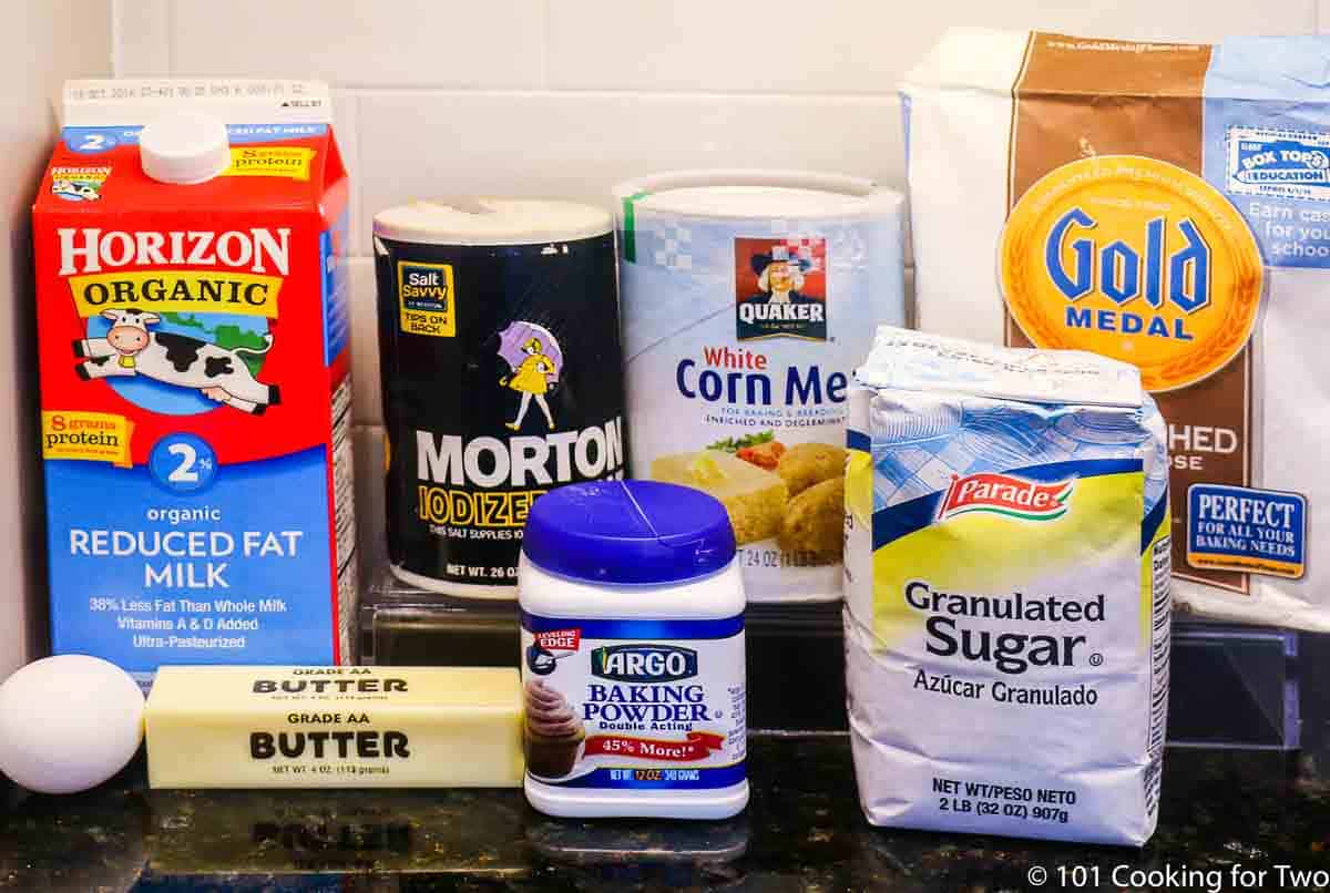 flour with butter and cornbread ingredients.