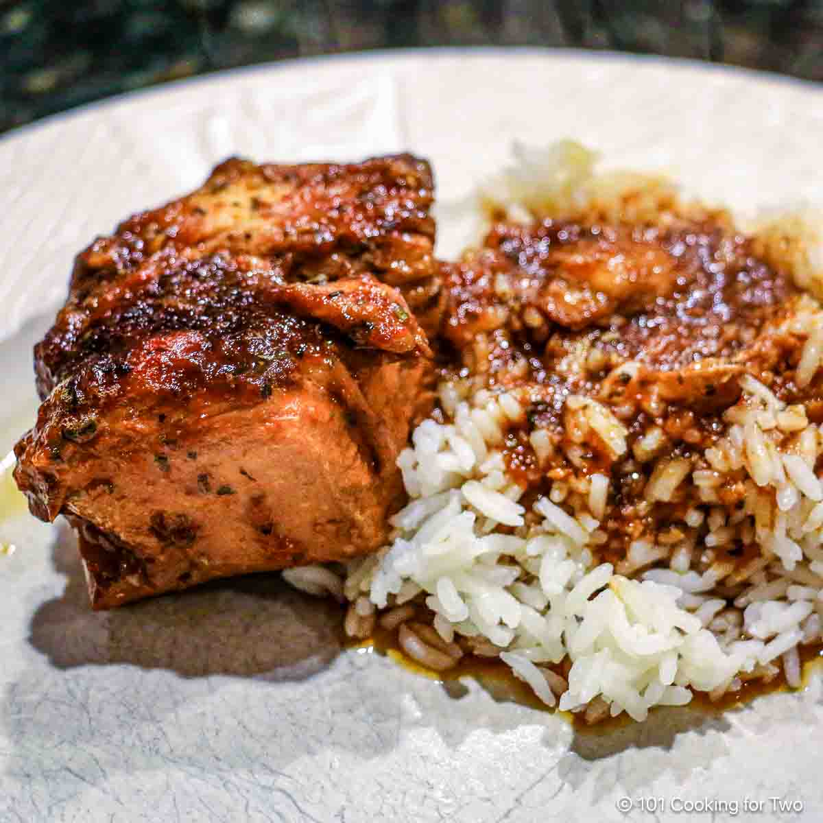 honey garlic chicken with rice on white plate