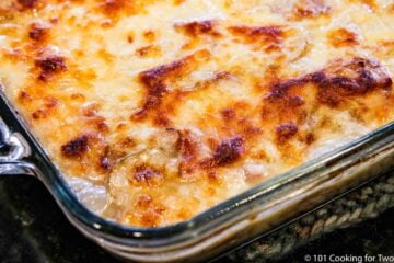 browned scalloped potatoes and ham out of the oven