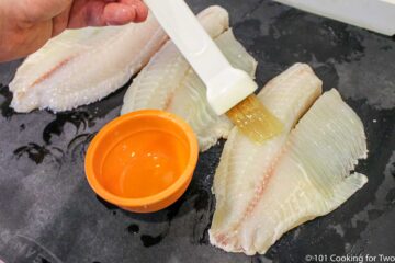 brushing tilapia with oil