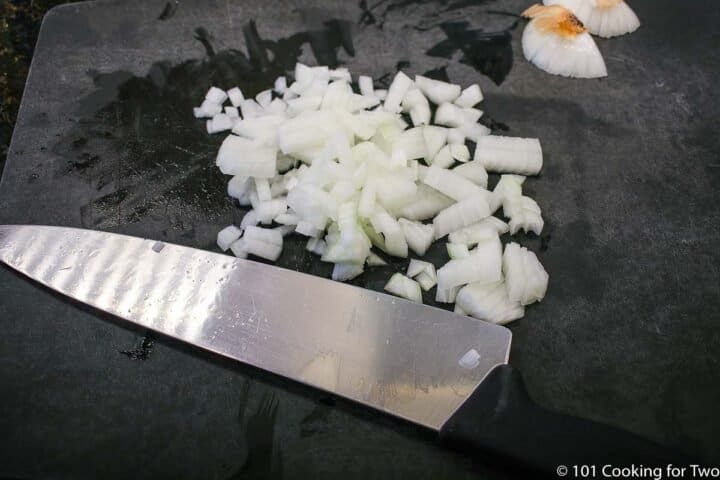 chopped onion on a black board