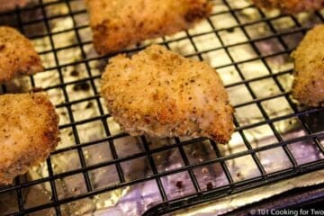 close up of cooked chicken nuggets on baking tray