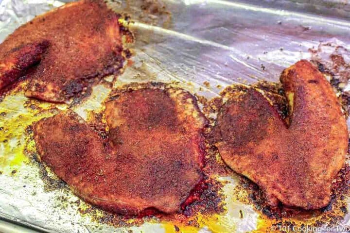 cooked blackened tilapia on the baking tray