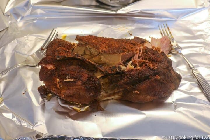 cooked pork butt on foil