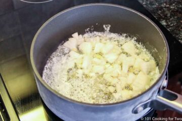 cooking chopped onion with butter in a sauce pan