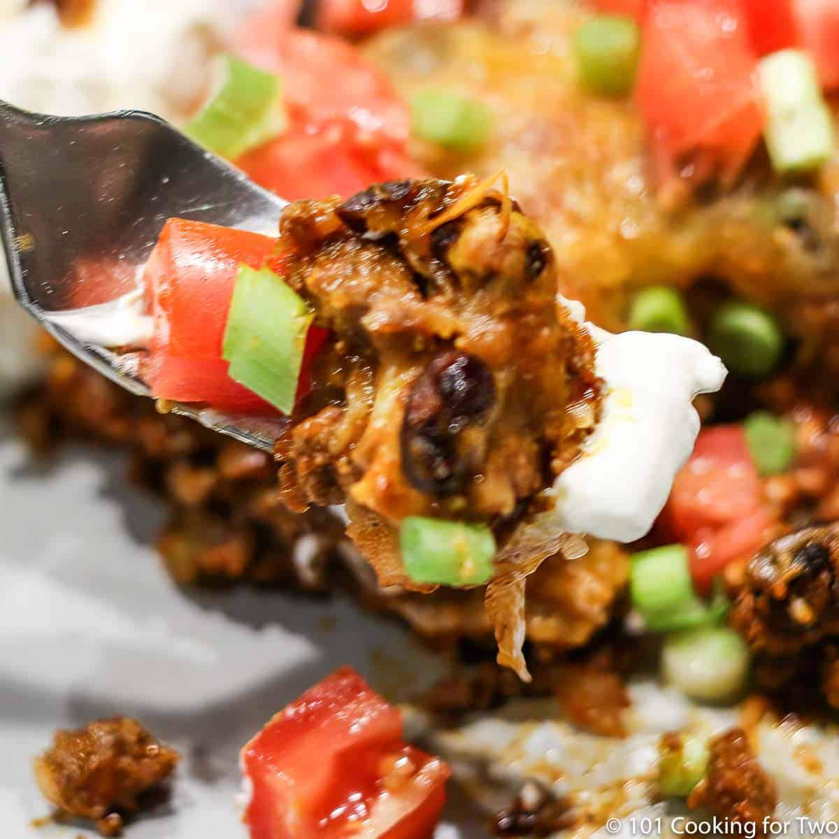 fork full of tortilla taco casserole