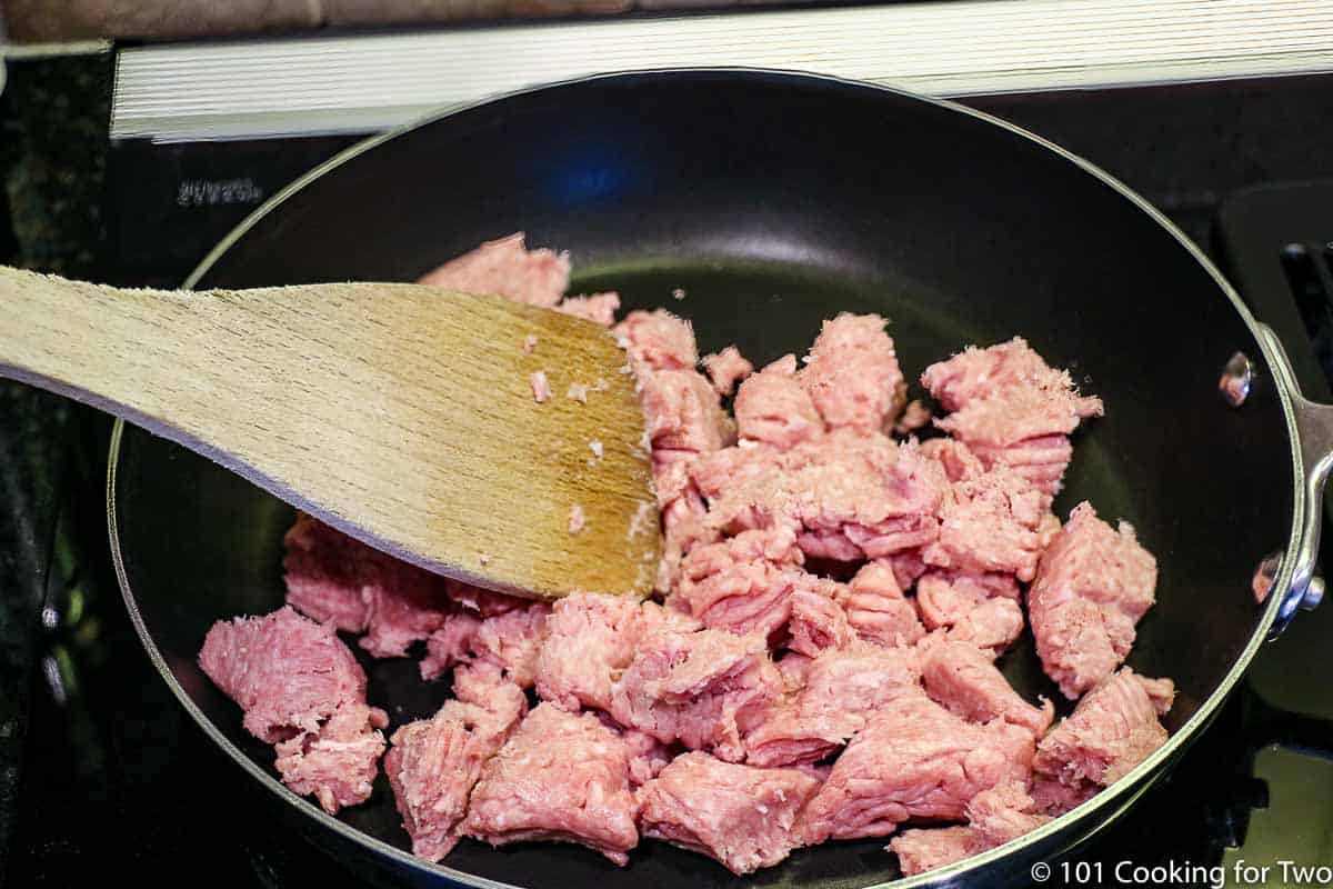 ground turkey browning in a frying pan