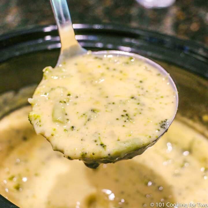ladle of broccoli cheese soup.