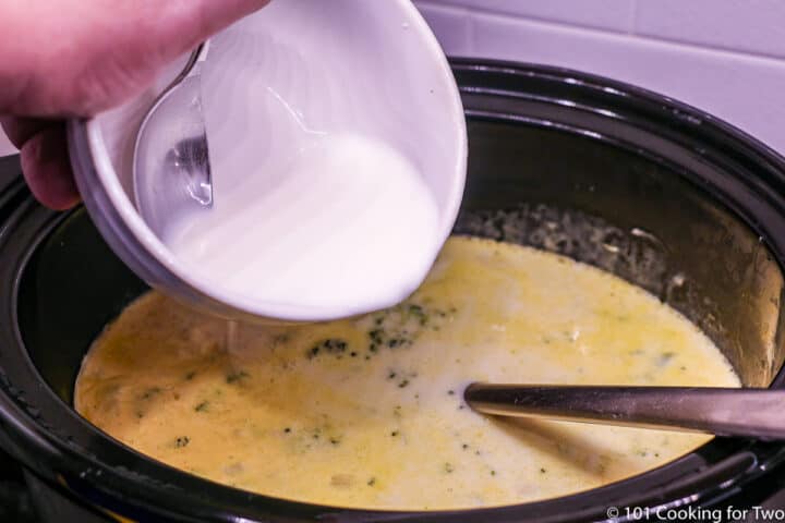 pouring the corn starch slurry into the crock pot