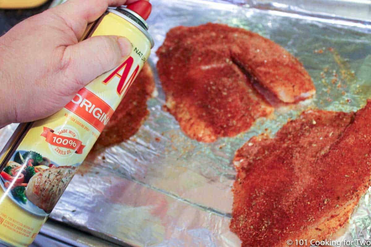 spraying tilapia with PAM