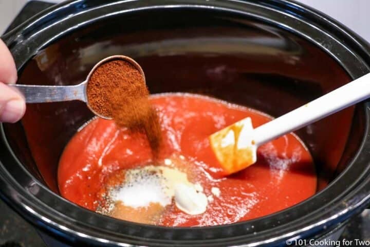 adding spices to crock pot