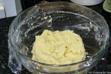 ball of dough in a covered bowl