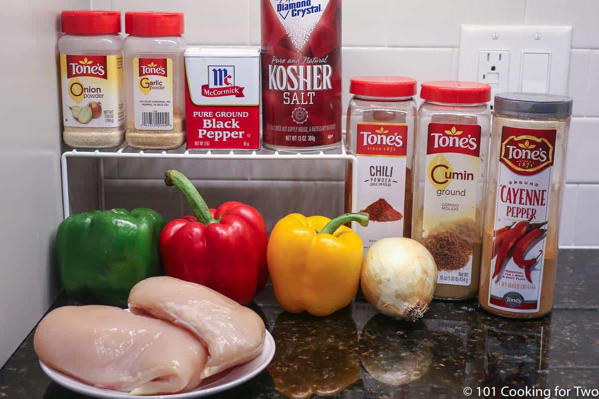 chicken breasts with spices and peppers.
