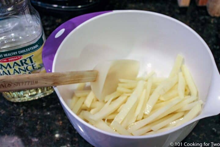 coating French fries with oil