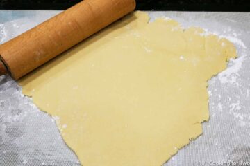 dough rolled onto floured mat