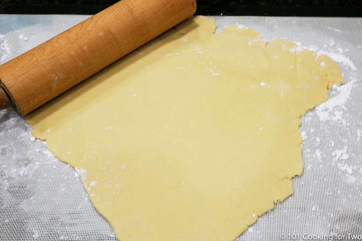 dough rolled onto floured mat