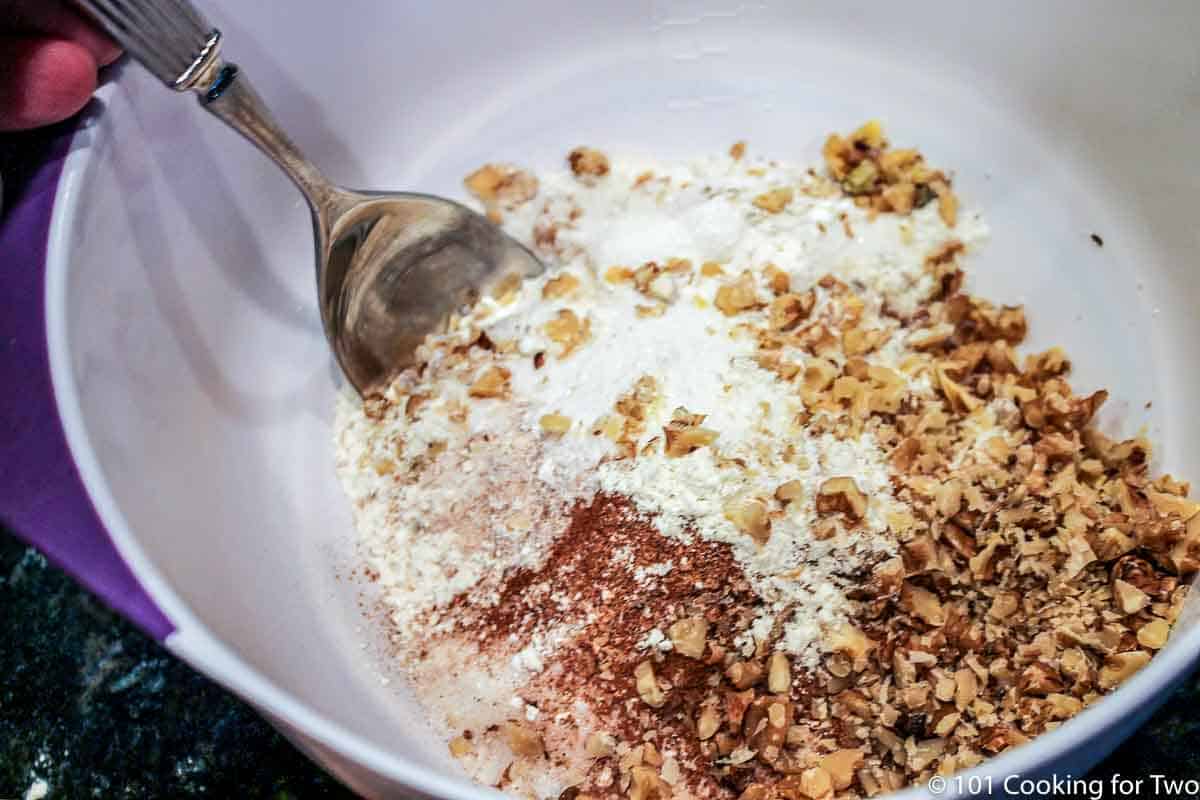 dry ingredients and nuts in large bowl.