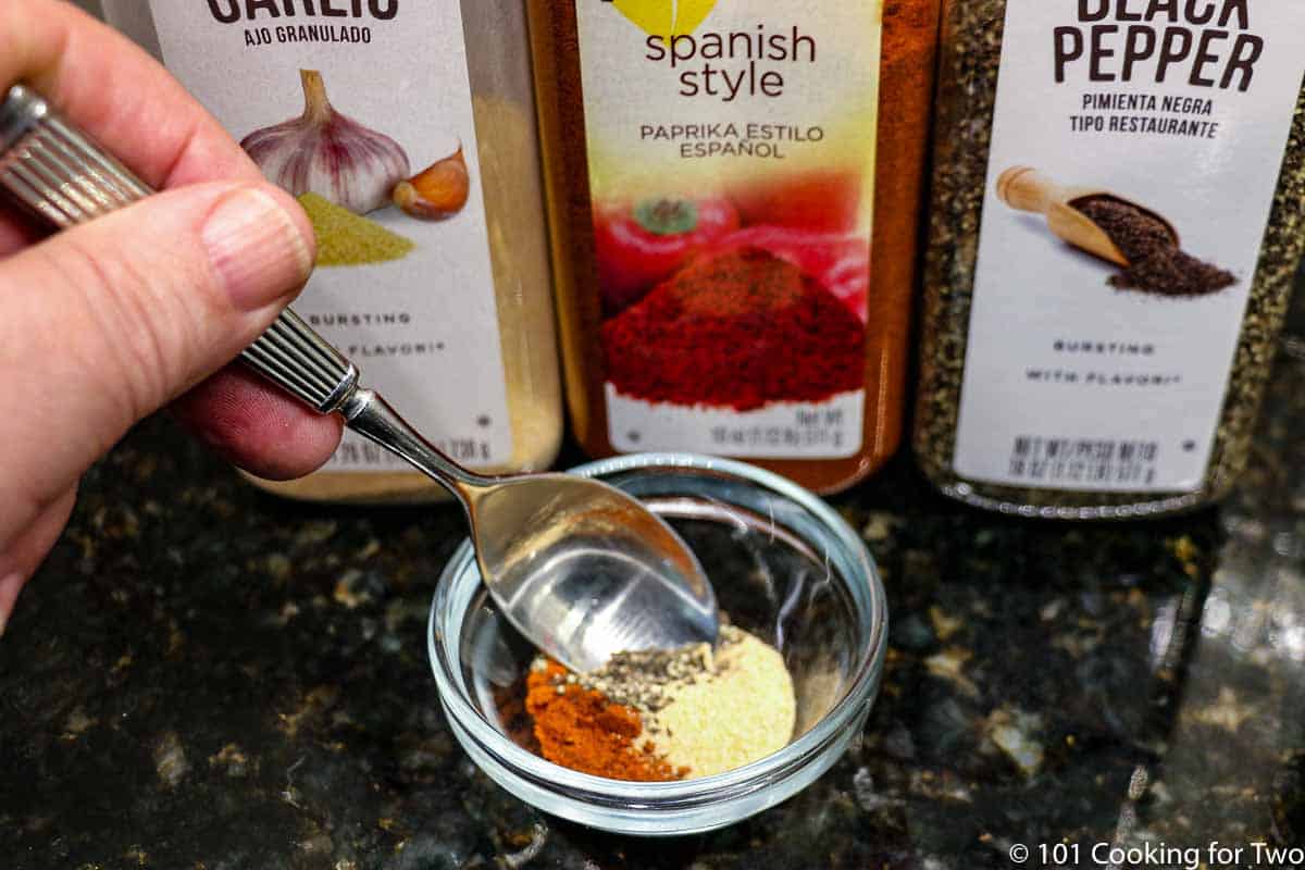 mixing spices in small bowl.