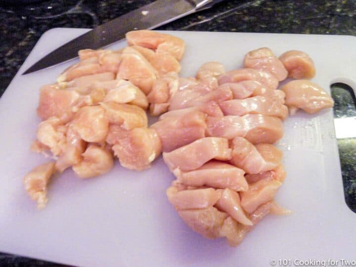 two chicken breasts trimmed into chunks