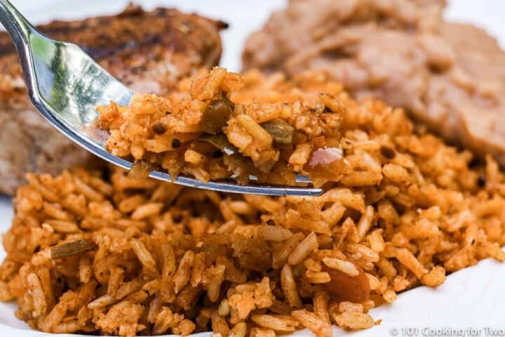 cooked Mexican rice on a white plate