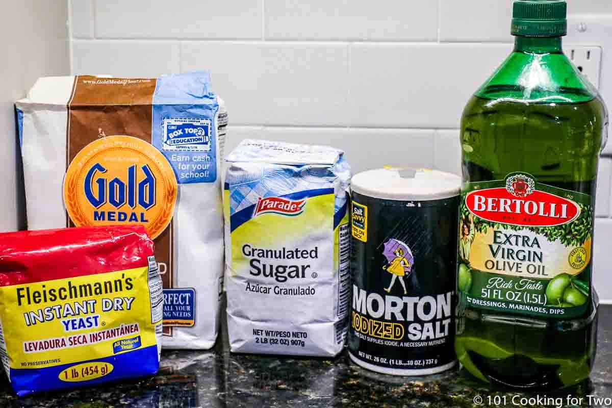 yeast with flour and other ingredients for pizza dough