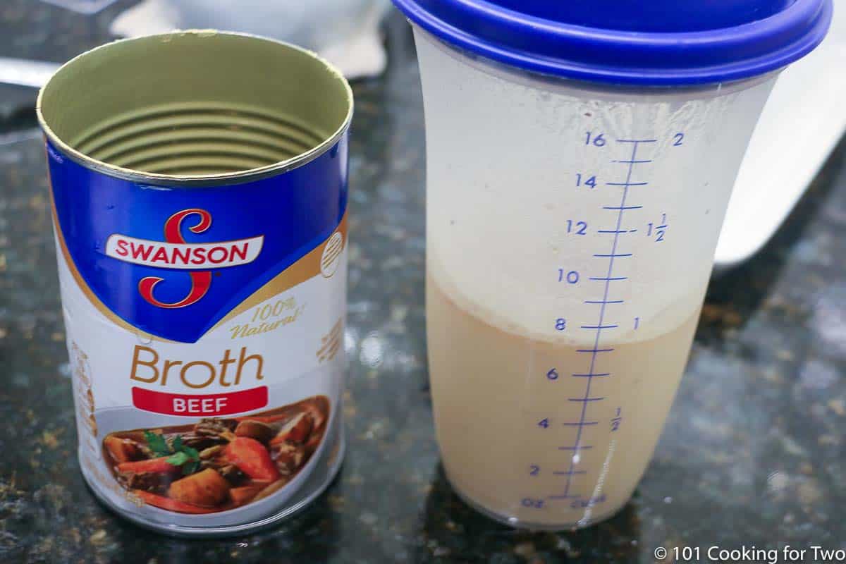 can of beef broth with shaker.