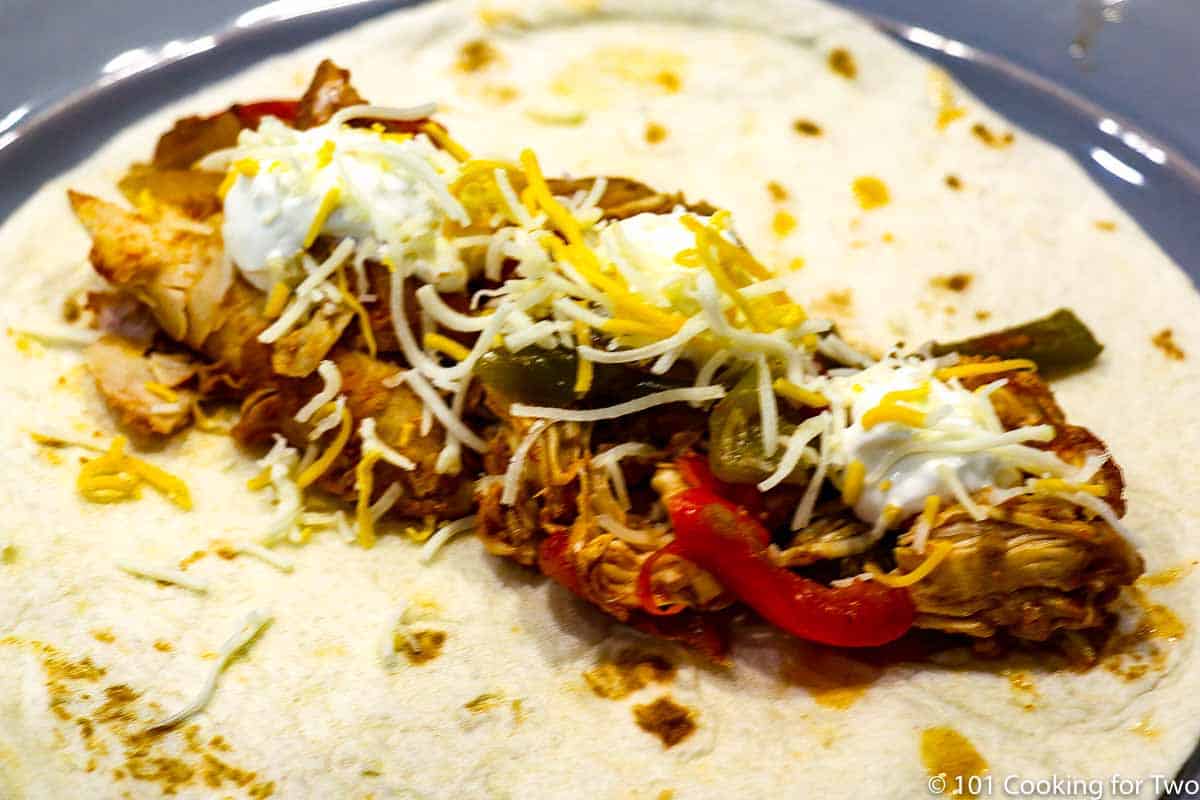 chicken fajitas topped with cheese wide view