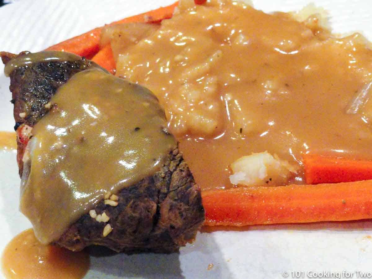 old fashioned Yankee pot roast on white plate -wide view.