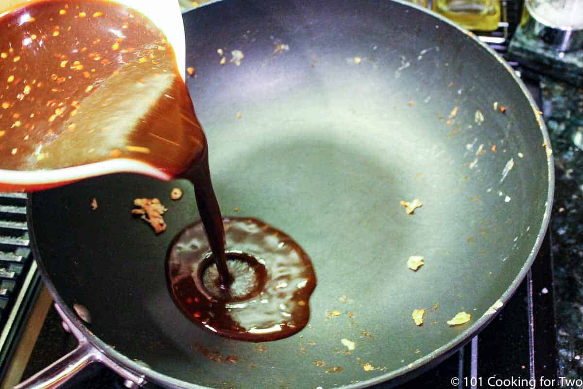 pouring sauce mixture into skillet