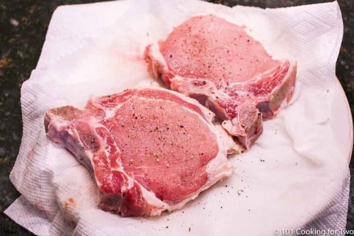 seasoned pork chops on paper towels