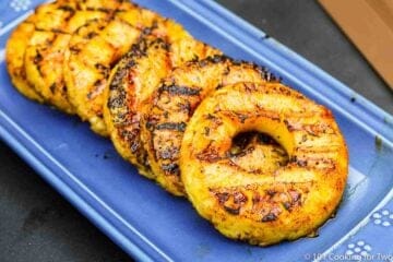 grilled pineapple on blue plate
