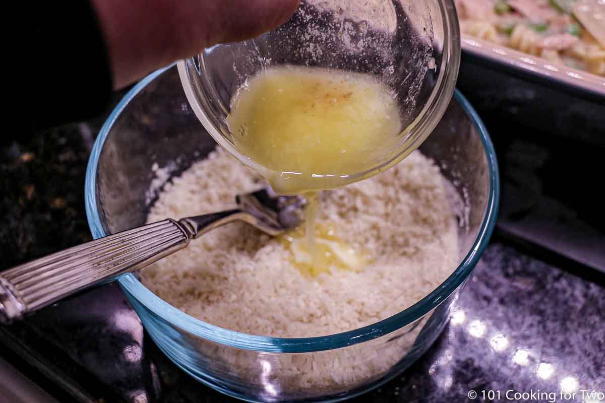 adding butter to topping.