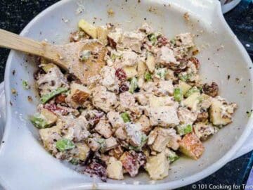 mixing all ingredients together for Waldorf chicken salad
