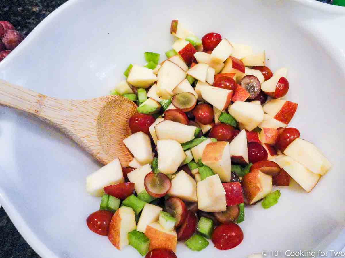 mixing fruit and vegtables with chicken