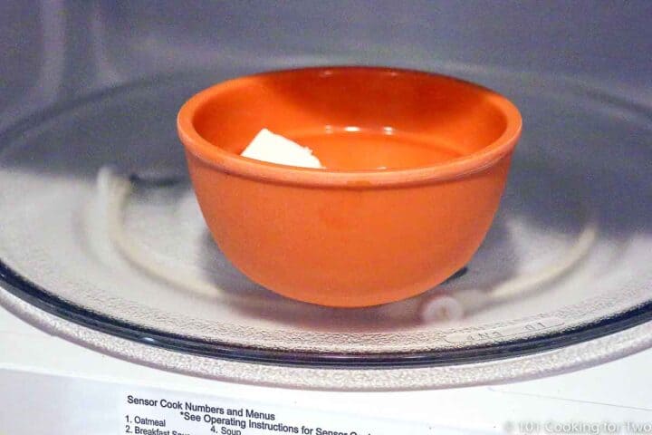 small bowl with butter in a microwave