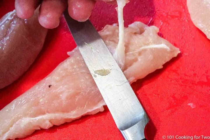 trimming tendon off a chicken tnderloin