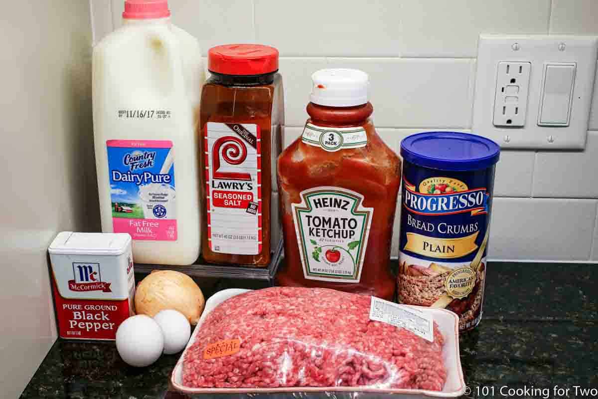 ground beef with ingredients for meatloaf.
