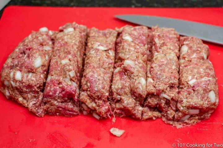 meat formed into loaf cut into equal pieces