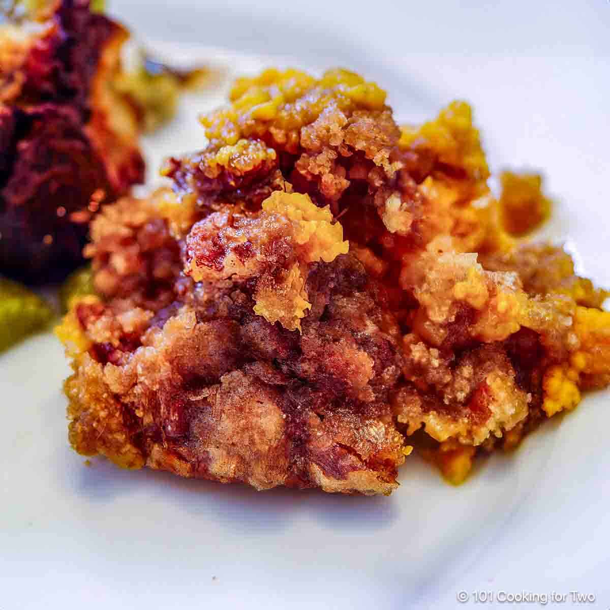 Sweet potato casserole on a white plate.