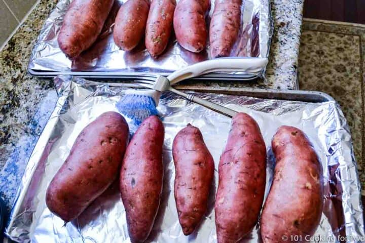 Uncooked sweet potatoes on baking tray