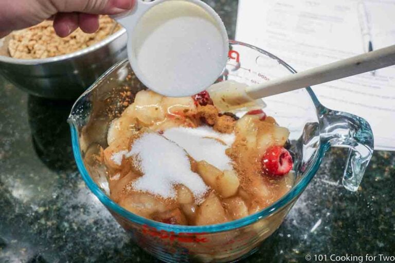 adding sugar to fruit mixture