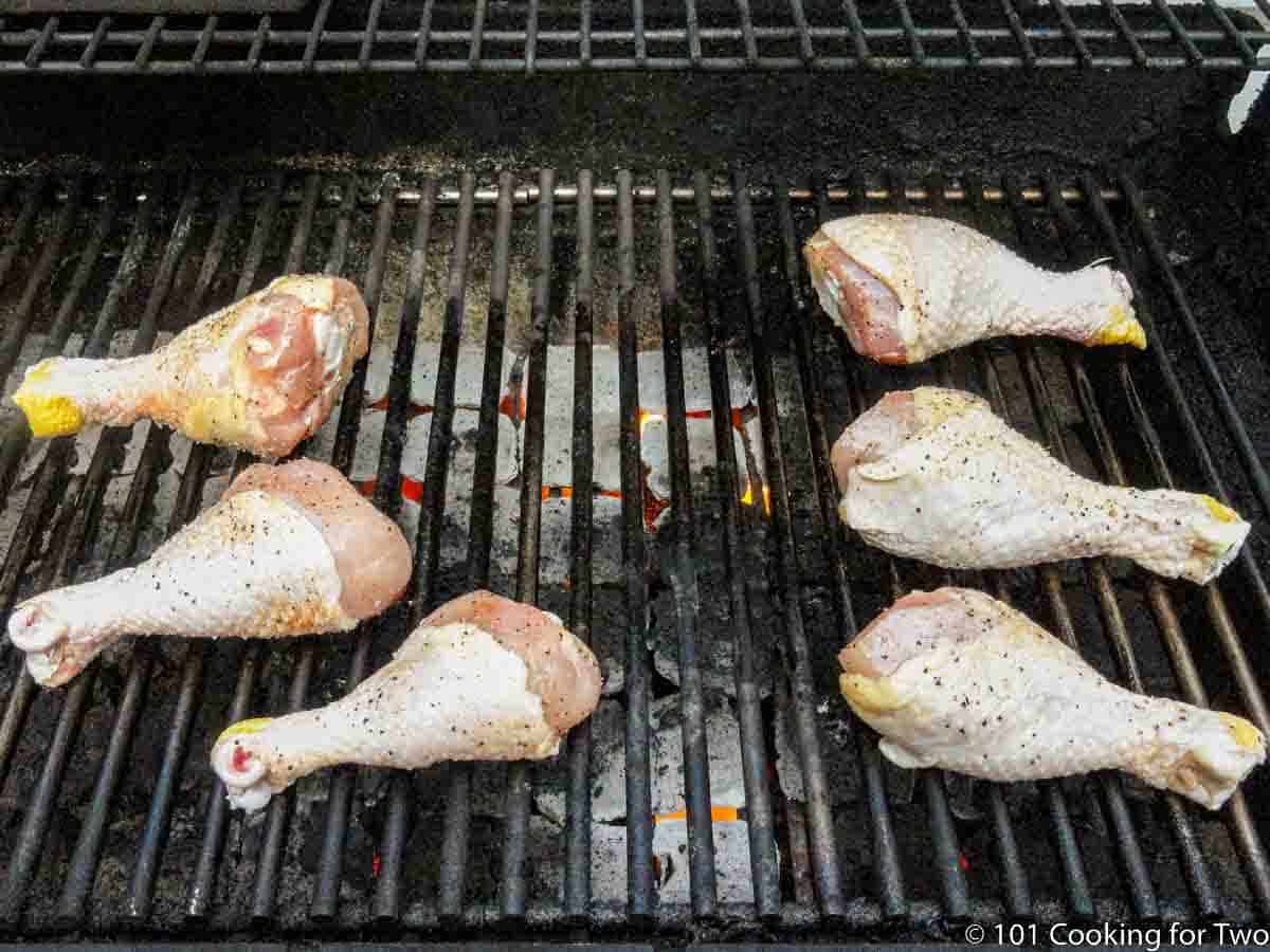 chicken drumsticks on the grill over direct heat