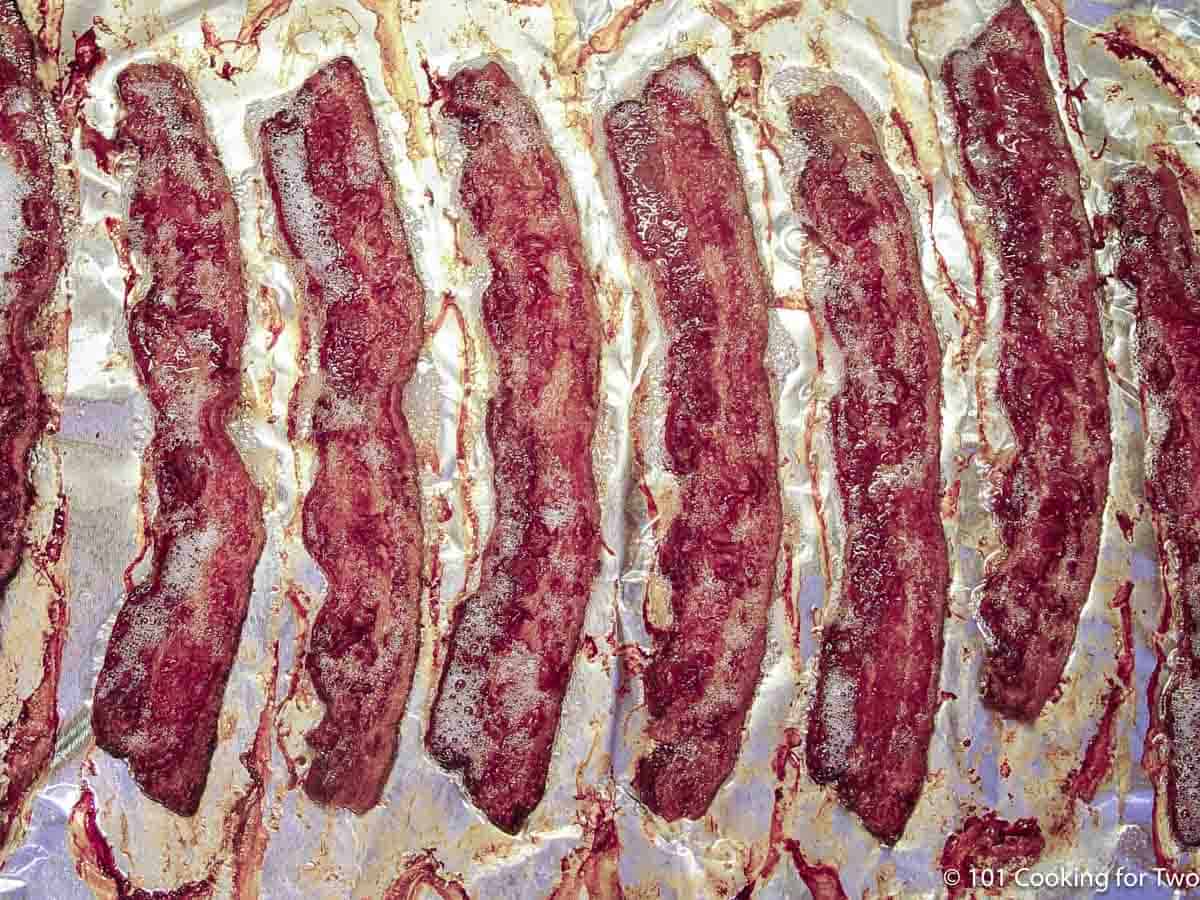baked bacon on a tray.