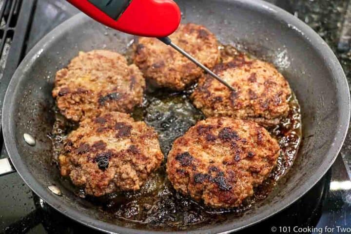 cooked meat patties in a skillet
