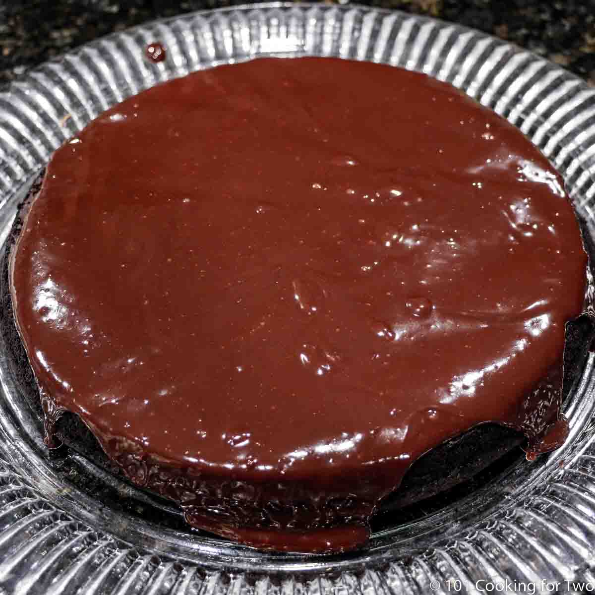flourless chocolate cake with glaze topping.